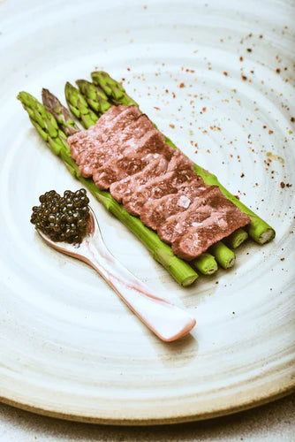 WAGYU BEEF WITH BABY ASPARAGUS TOPPED WITH CELESTE CAVIAR